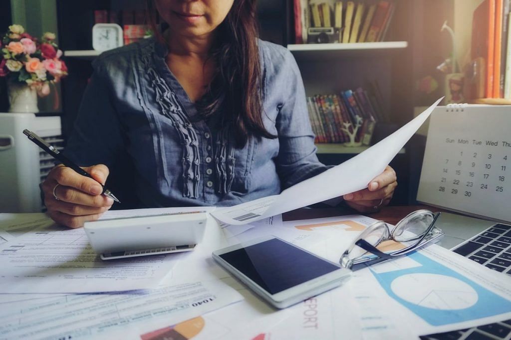 shopify sales tax - a woman working in a desk