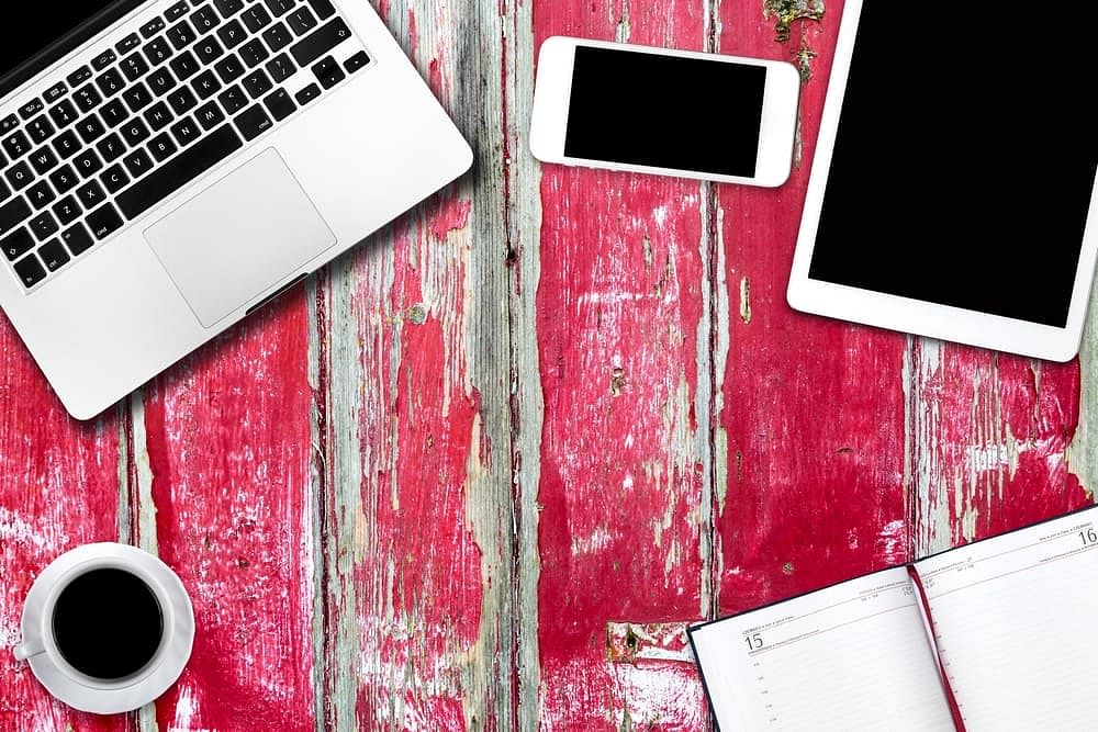 Apple devices on a wooden table