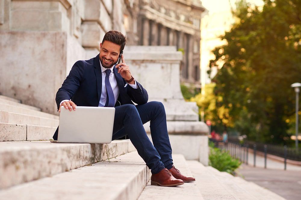 Businessman hustle on stairs with his laptop out