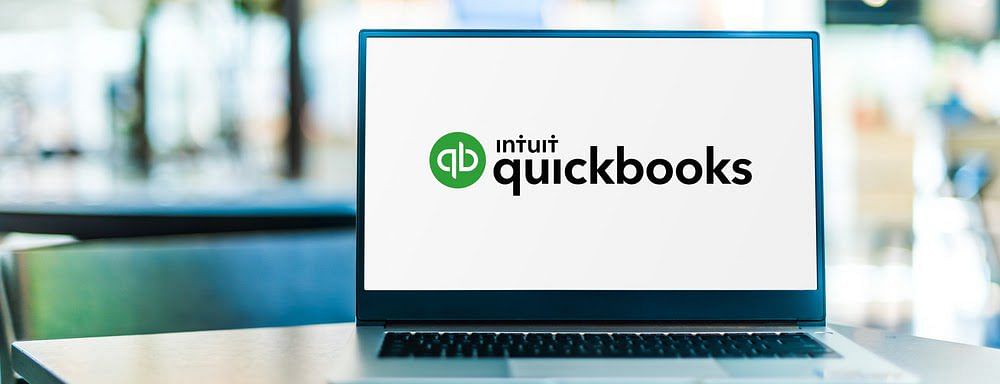A QuickBooks logo displayed on a laptop screen