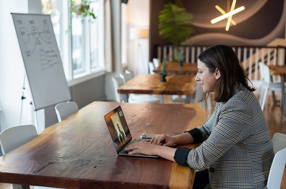 a businesswoman meeting with her client through online