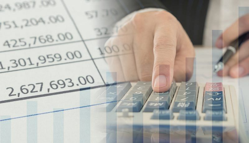 On The left: amounts printed on a two-column sheet. On the right: a man’s finger pressing a key on a calculator